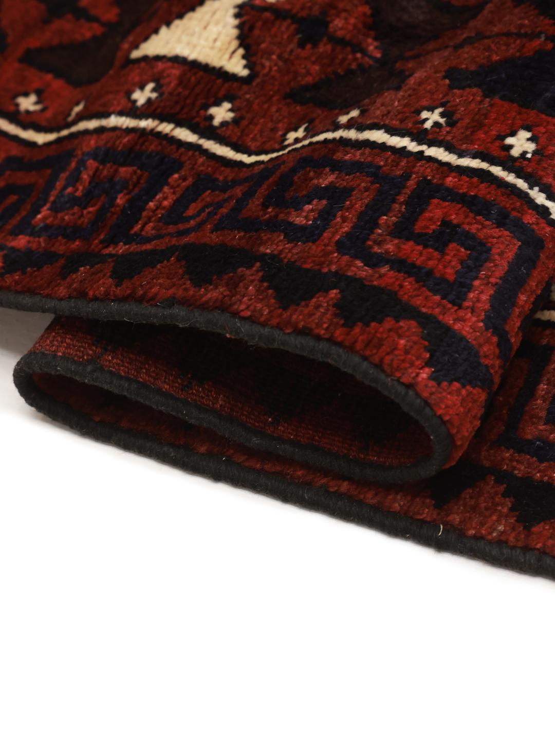 Hand-knotted Lori rug from the Middle East featuring a dark-red geometric pattern