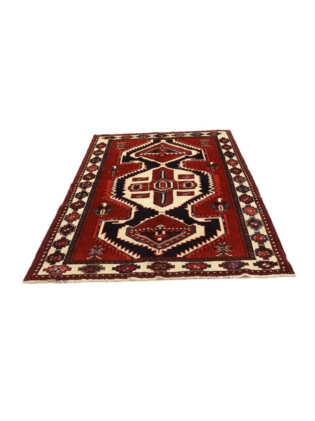 A hand-knotted Lori rug from the Middle East featuring a vibrant red and black geometric medallion design.