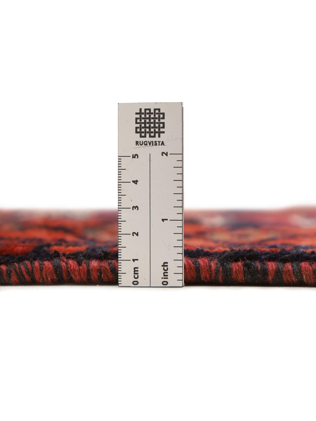 A hand-knotted Lori rug from the Middle East featuring geometric patterns in dark red and black.