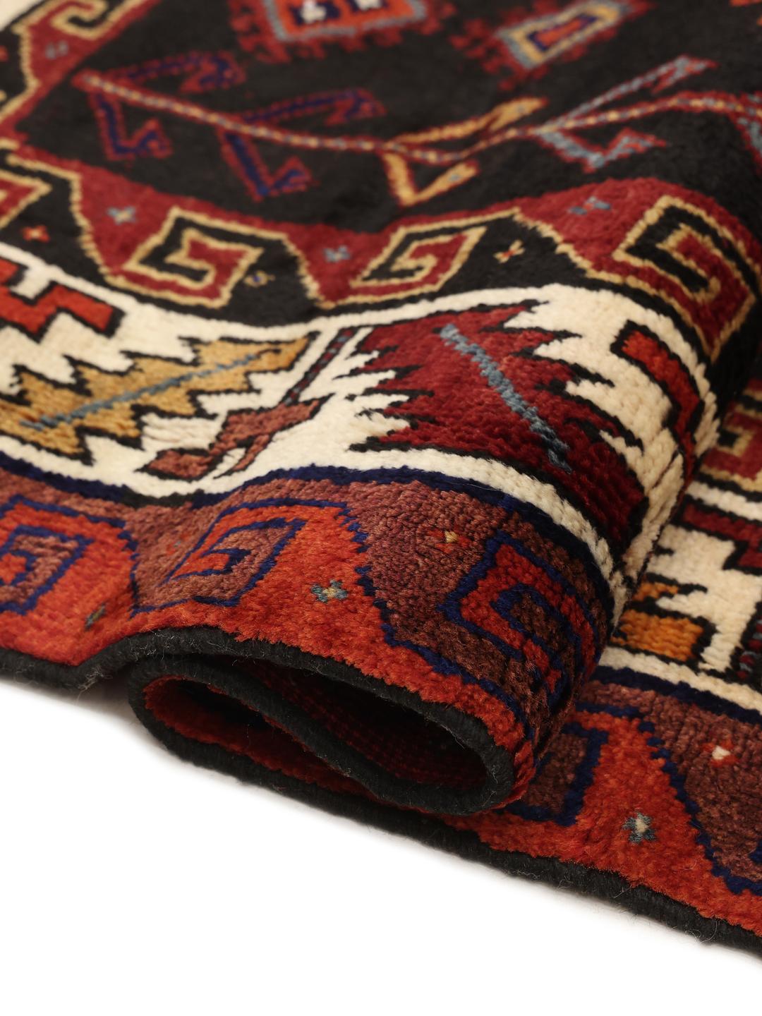Hand-knotted Lori rug from the Middle East featuring a dark-red and dark-blue geometric pattern
