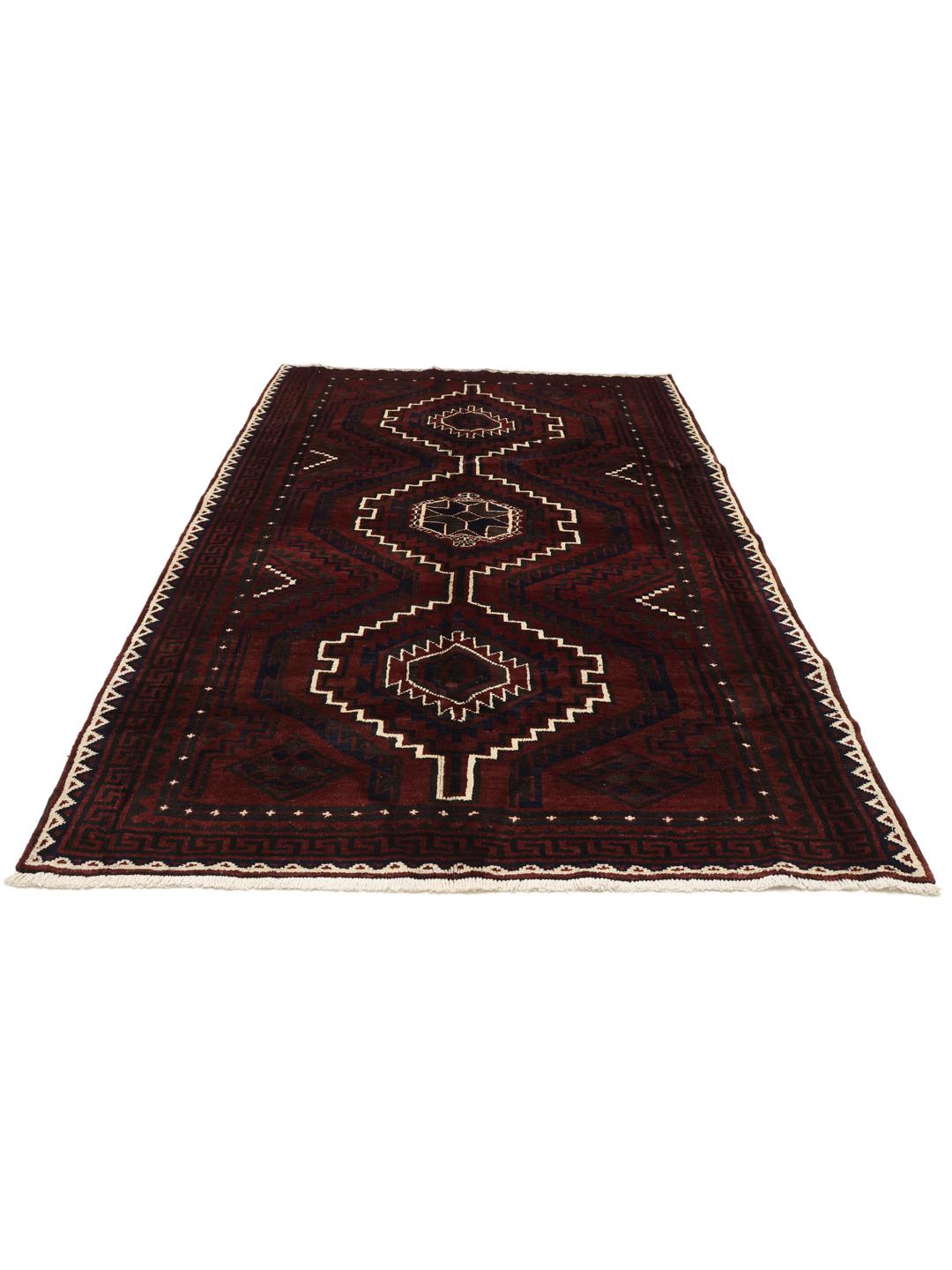 A hand-knotted Lori rug from the Middle East in dark-red with geometric patterns