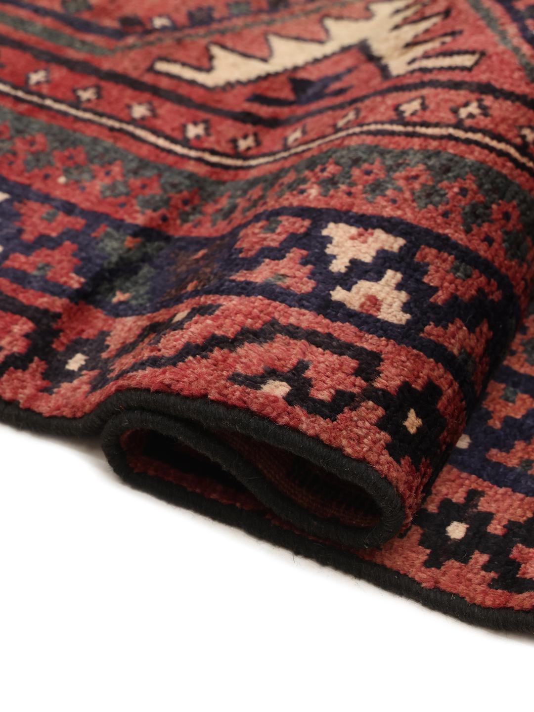 Hand-knotted Lori rug from the Middle East in deep red and blue tones