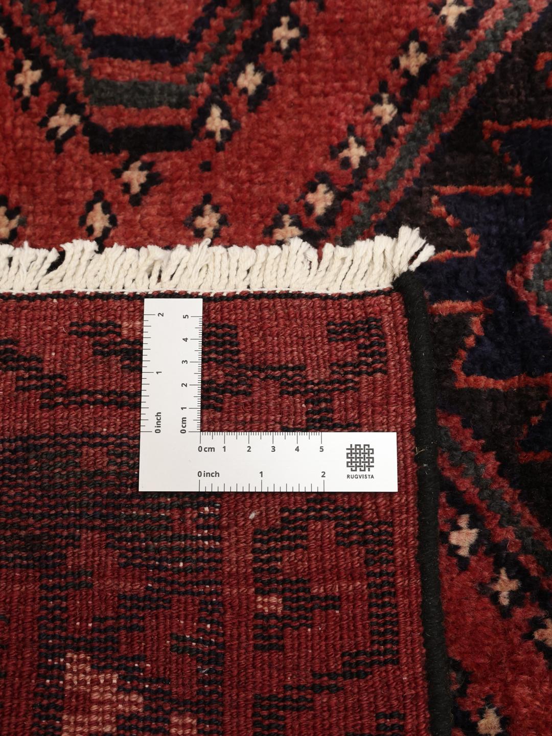 Hand-knotted Lori rug from the Middle East in deep red and blue tones