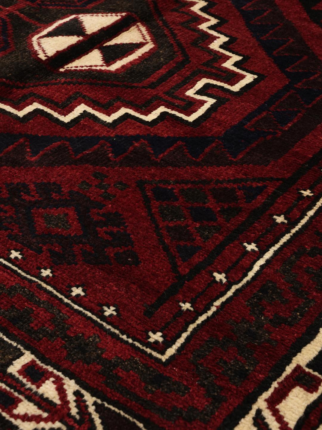 Hand-knotted Lori rug from the Middle East in dark-red tones