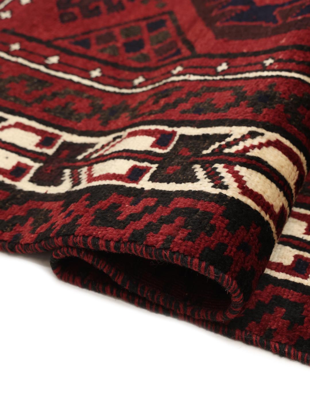Hand-knotted Lori rug from the Middle East in dark-red tones