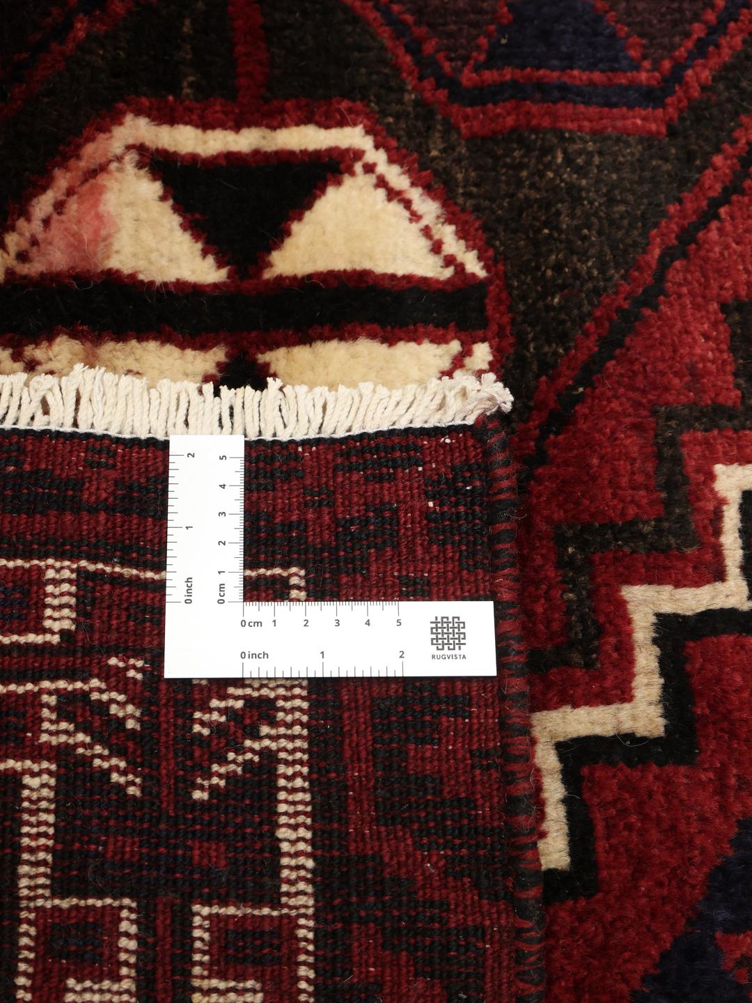 Hand-knotted Lori rug from the Middle East in dark-red tones