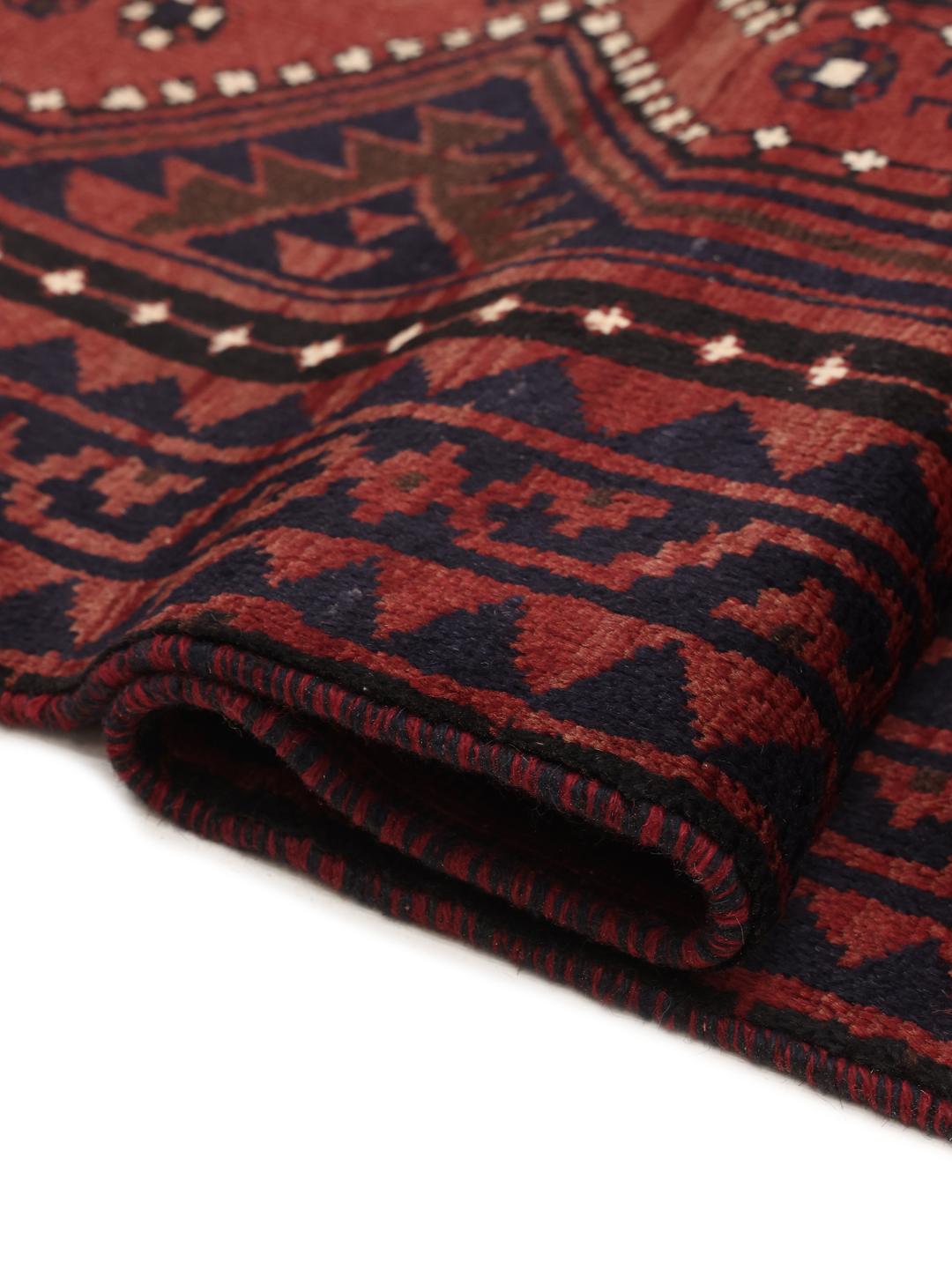 Hand-knotted Lori rug from the Middle East in dark-red and dark-blue tones.