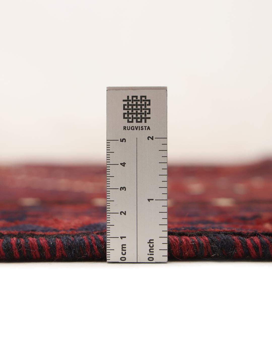 Hand-knotted Lori rug from the Middle East in dark-red and dark-blue tones.