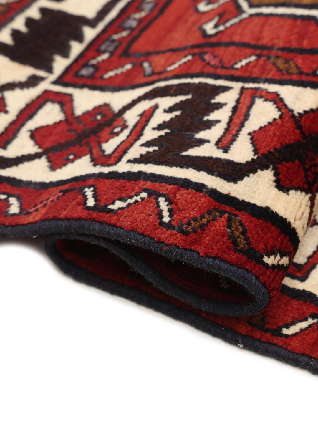 Hand-knotted Lori rug from the Middle East in dark red and black tones