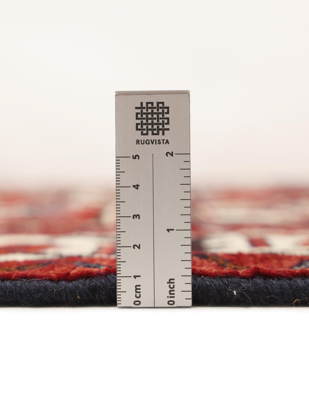 Hand-knotted Lori rug from the Middle East in dark red and black tones