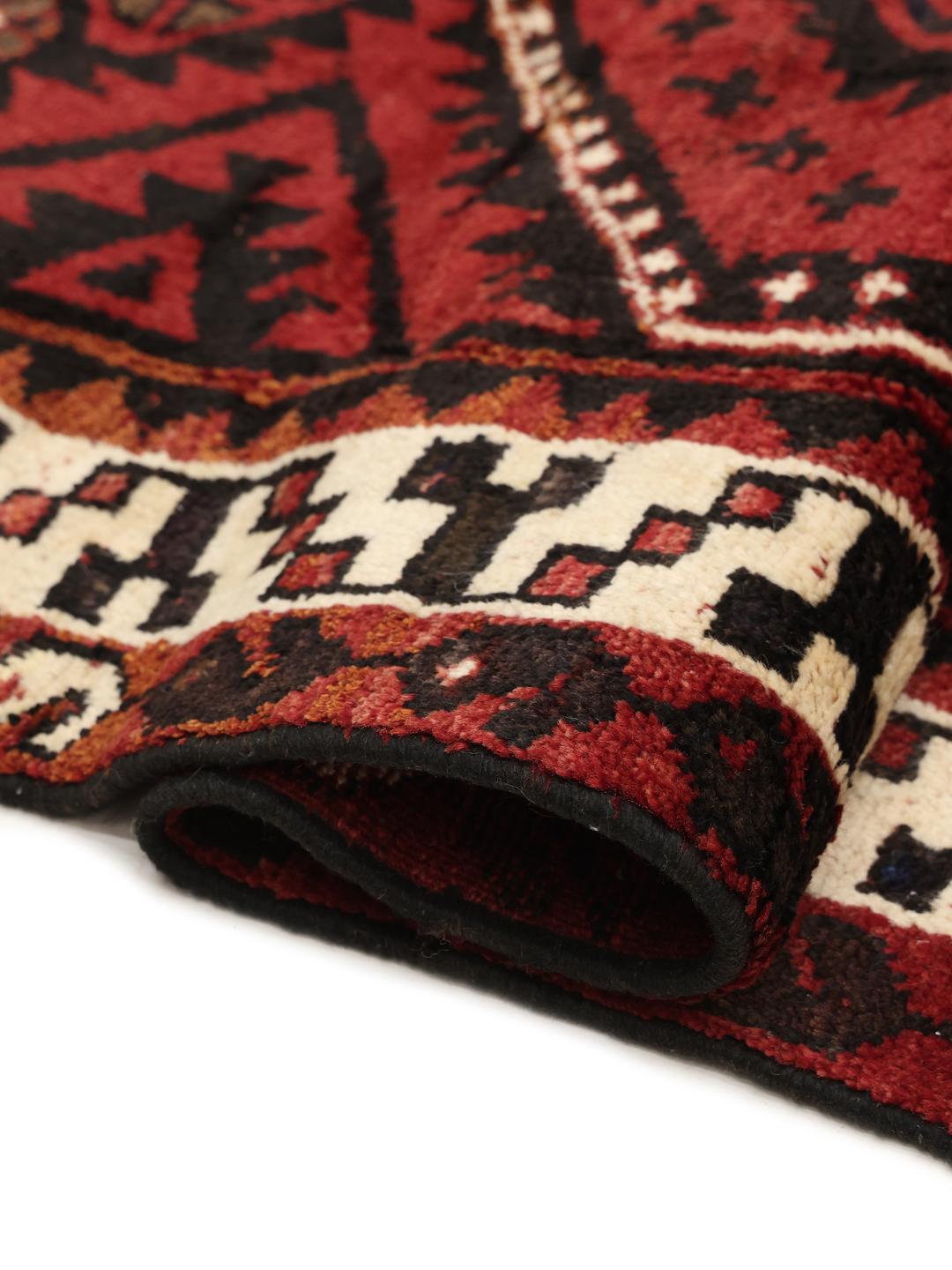 Hand-knotted Lori rug from the Middle East in dark-red and black tones.