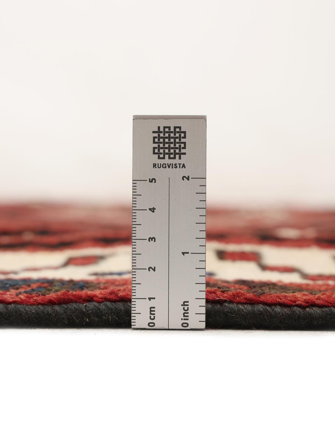 Hand-knotted Lori rug from the Middle East in dark-red and black tones.