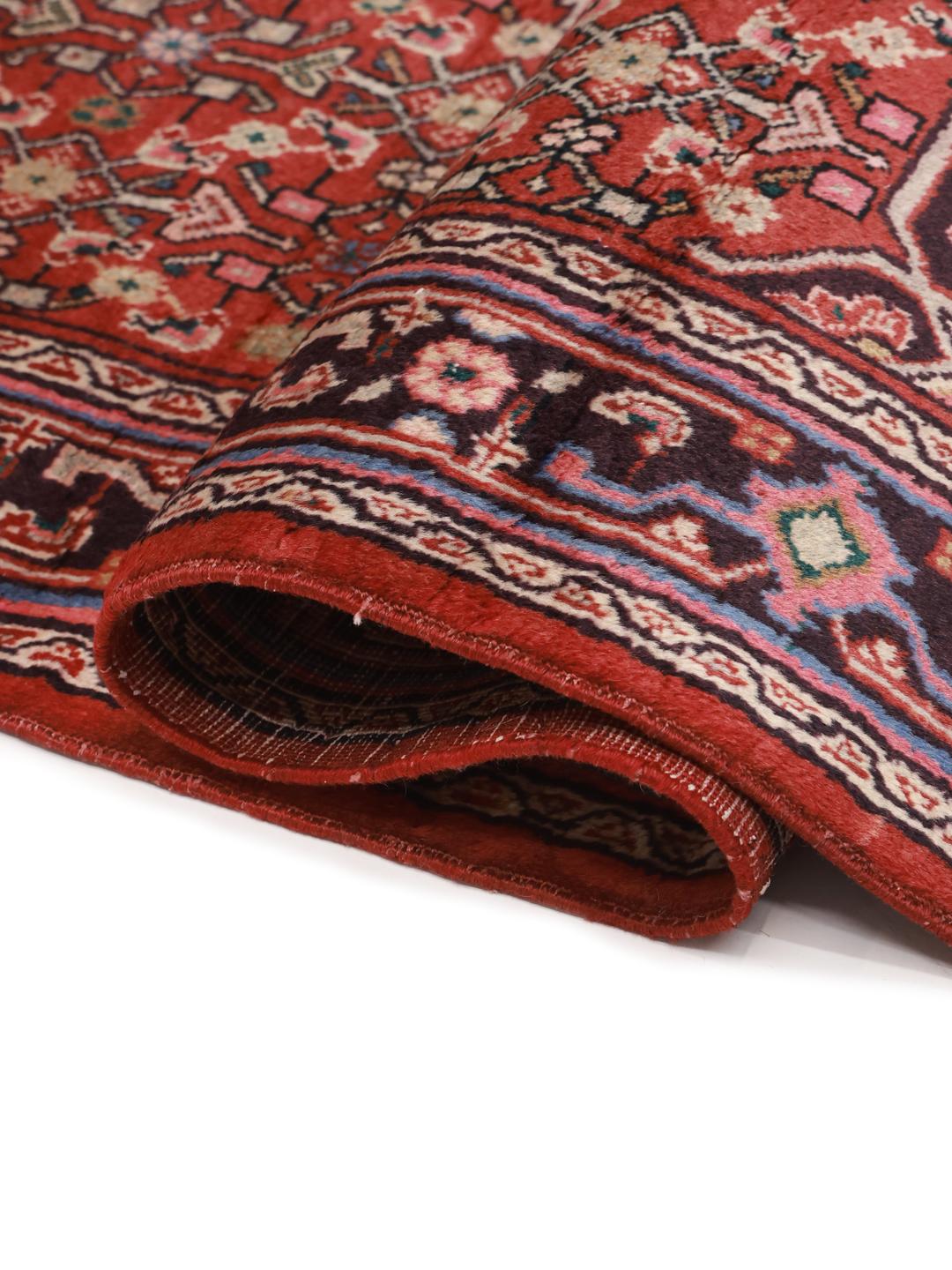 Hand-knotted Hamadan rug from the Middle East in vibrant red with traditional medallion patterns.