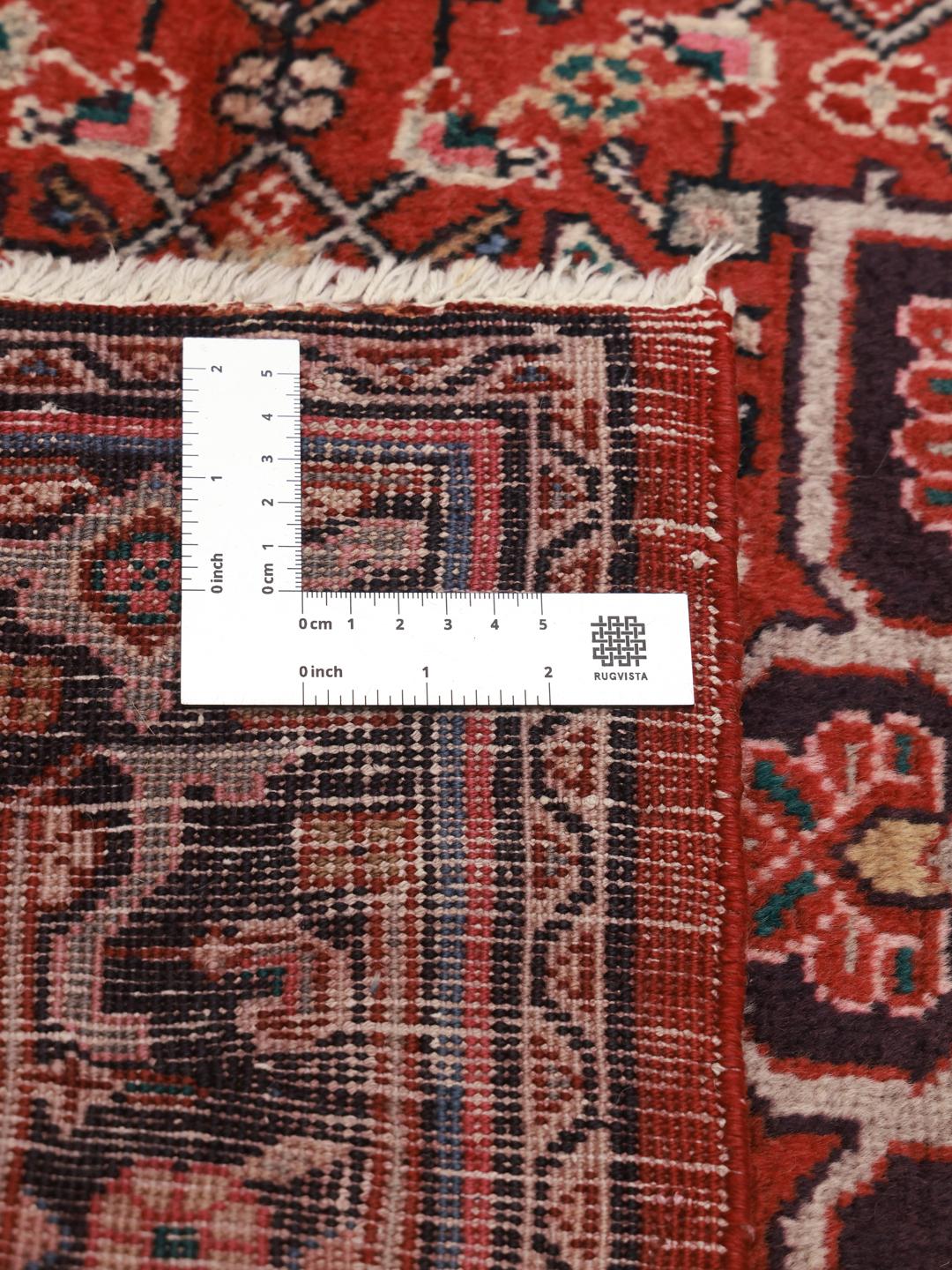Hand-knotted Hamadan rug from the Middle East in vibrant red with traditional medallion patterns.