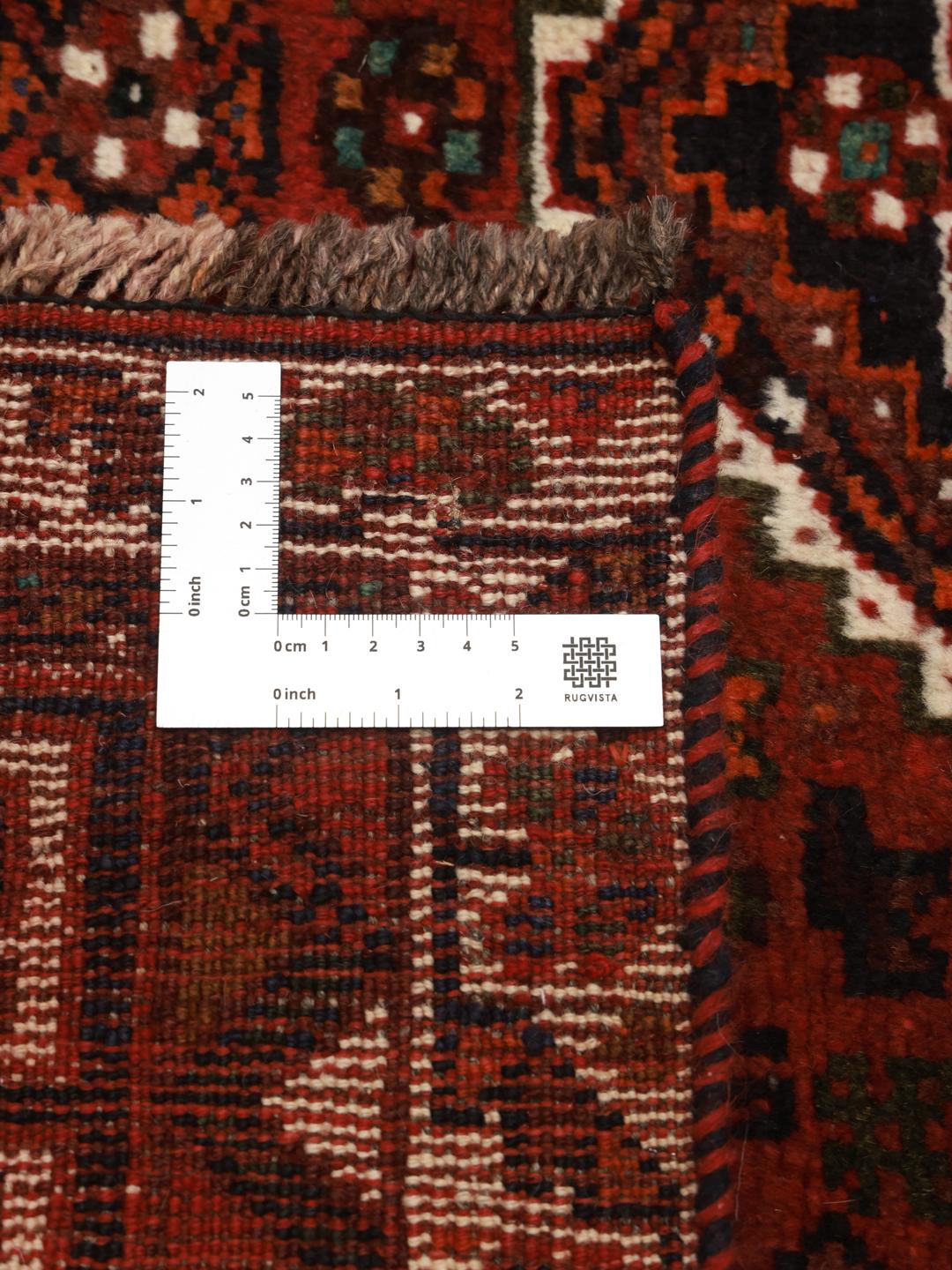 Hand-knotted red Shiraz rug with geometric tribal patterns from the Middle East