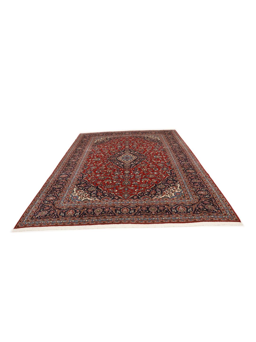 A hand-knotted red Keshan rug from the Middle East with a floral medallion pattern.