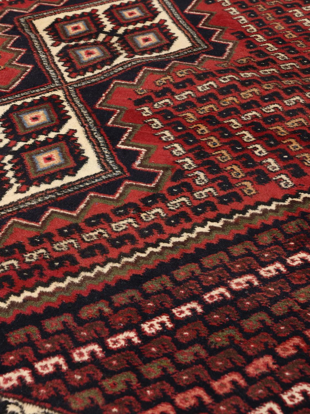 Hand-knotted Afshar Shahre Babak rug with red and dark-blue geometric patterns