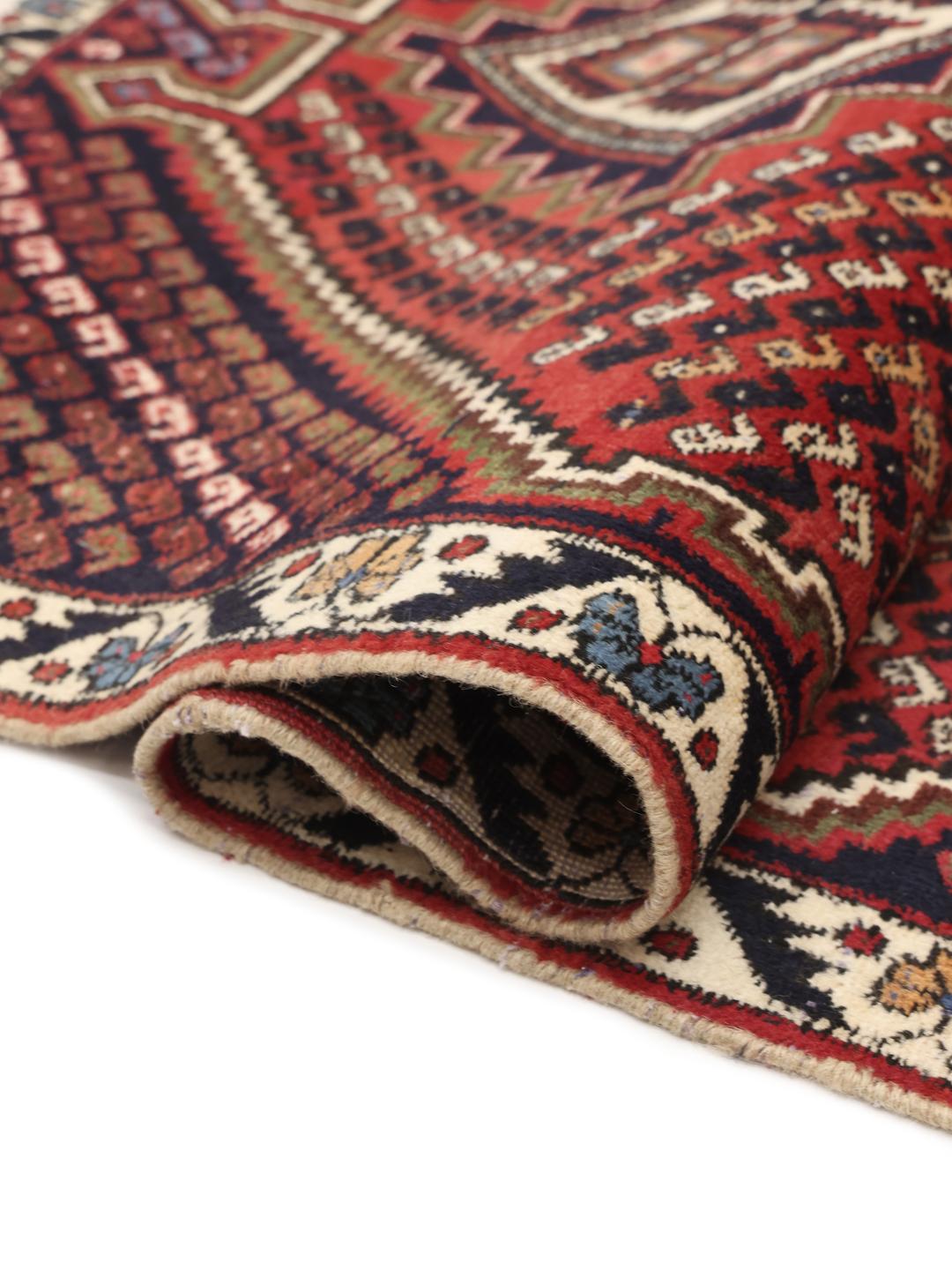 Hand-knotted Afshar Shahre Babak rug with red and dark-blue geometric patterns