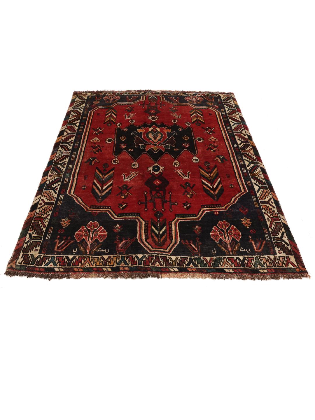 Hand-knotted Shiraz rug from the Middle East in deep red and dark blue tones