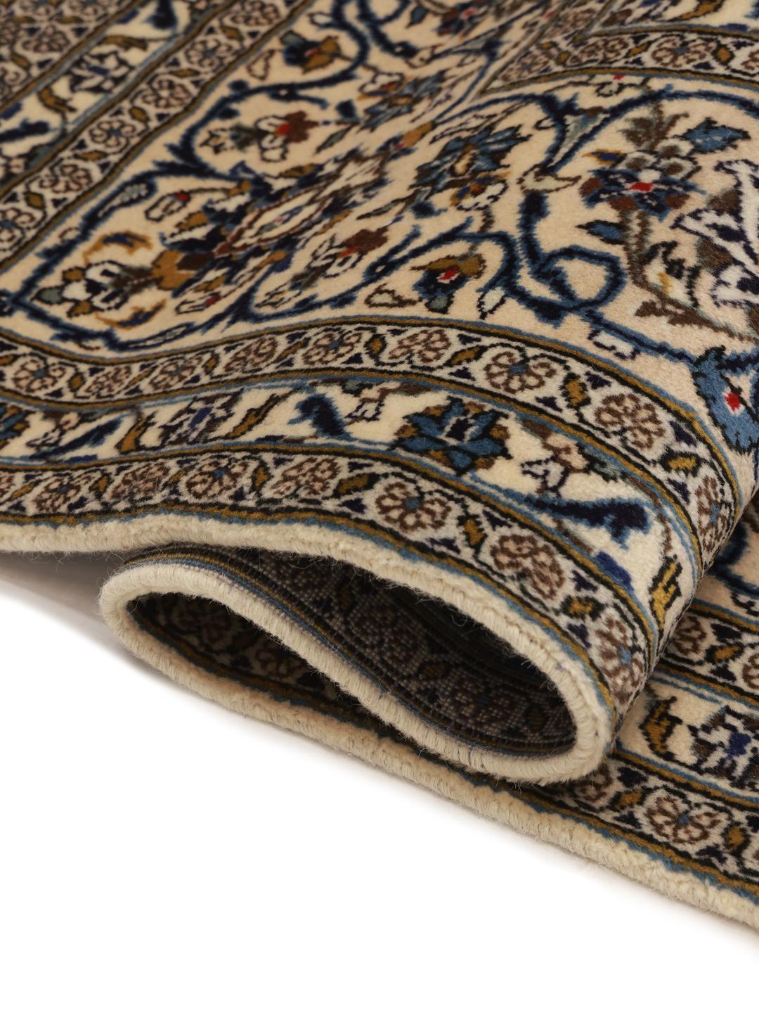 Hand-knotted Keshan rug with floral patterns in beige and blue tones