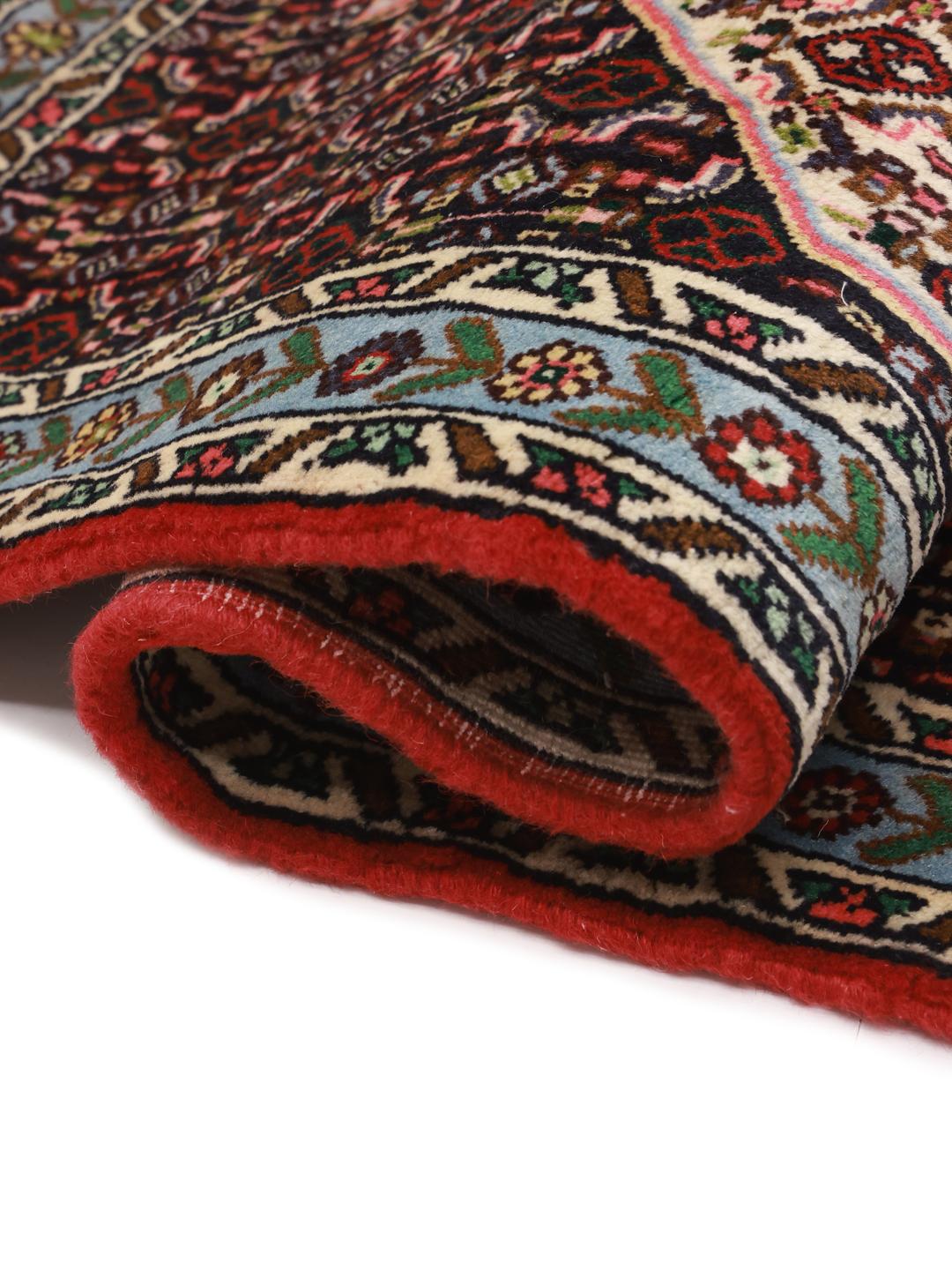 Hand-knotted Senneh rug from the Middle East featuring a vibrant multicolor geometric pattern