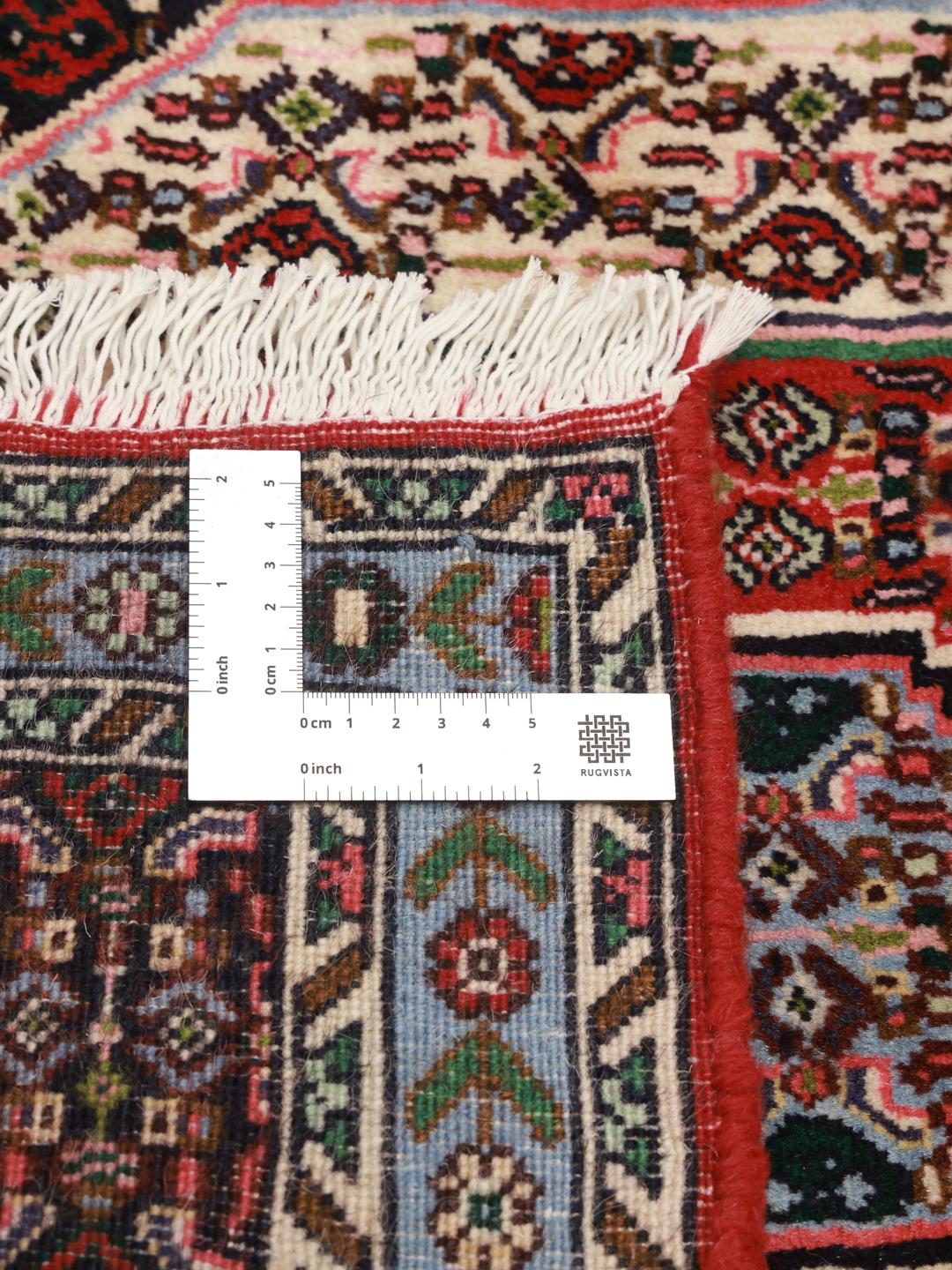 Hand-knotted Senneh rug from the Middle East featuring a vibrant multicolor geometric pattern