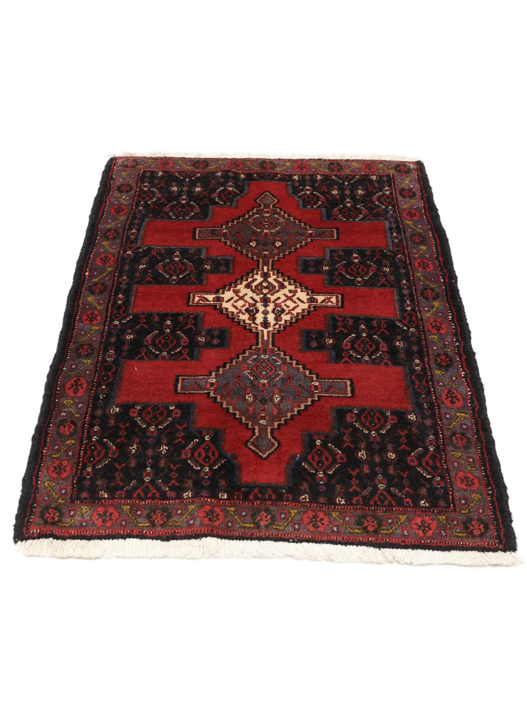 Hand-knotted Senneh rug from the Middle East in red and black