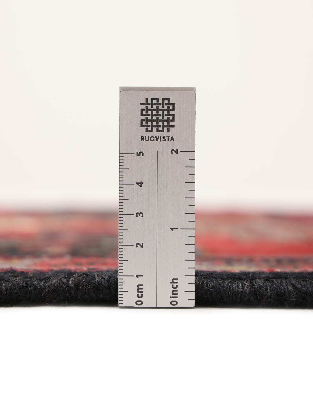 Hand-knotted Senneh rug from the Middle East in red and black