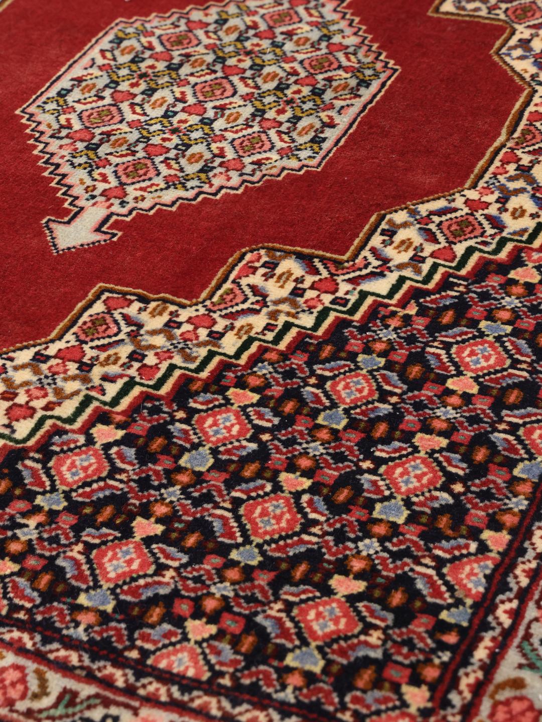 Hand-knotted Senneh Wool rug from the Middle East in red and navy