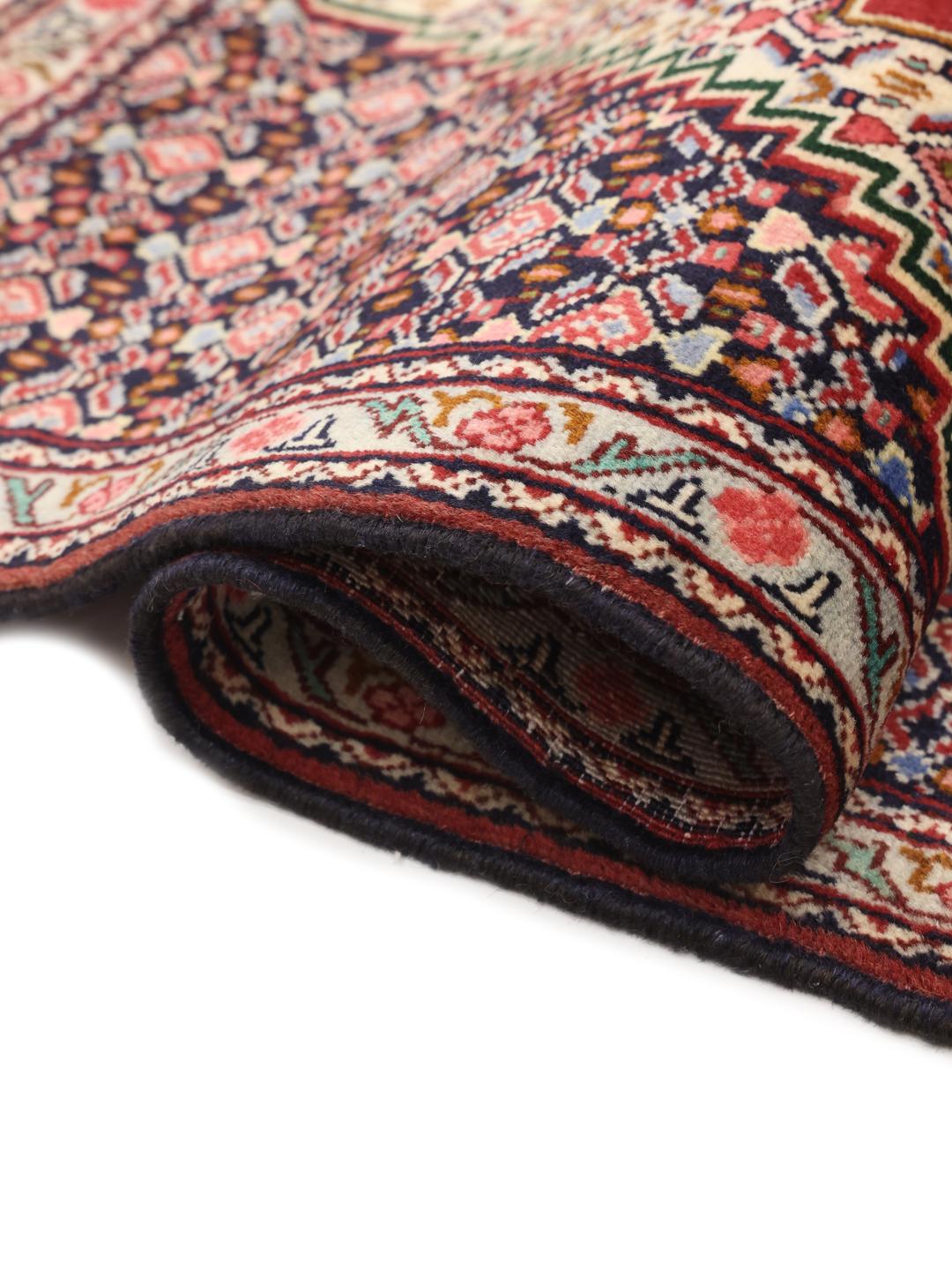 Hand-knotted Senneh Wool rug from the Middle East in red and navy