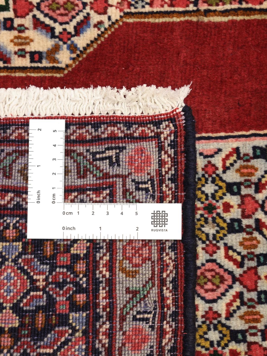 Hand-knotted Senneh Wool rug from the Middle East in red and navy