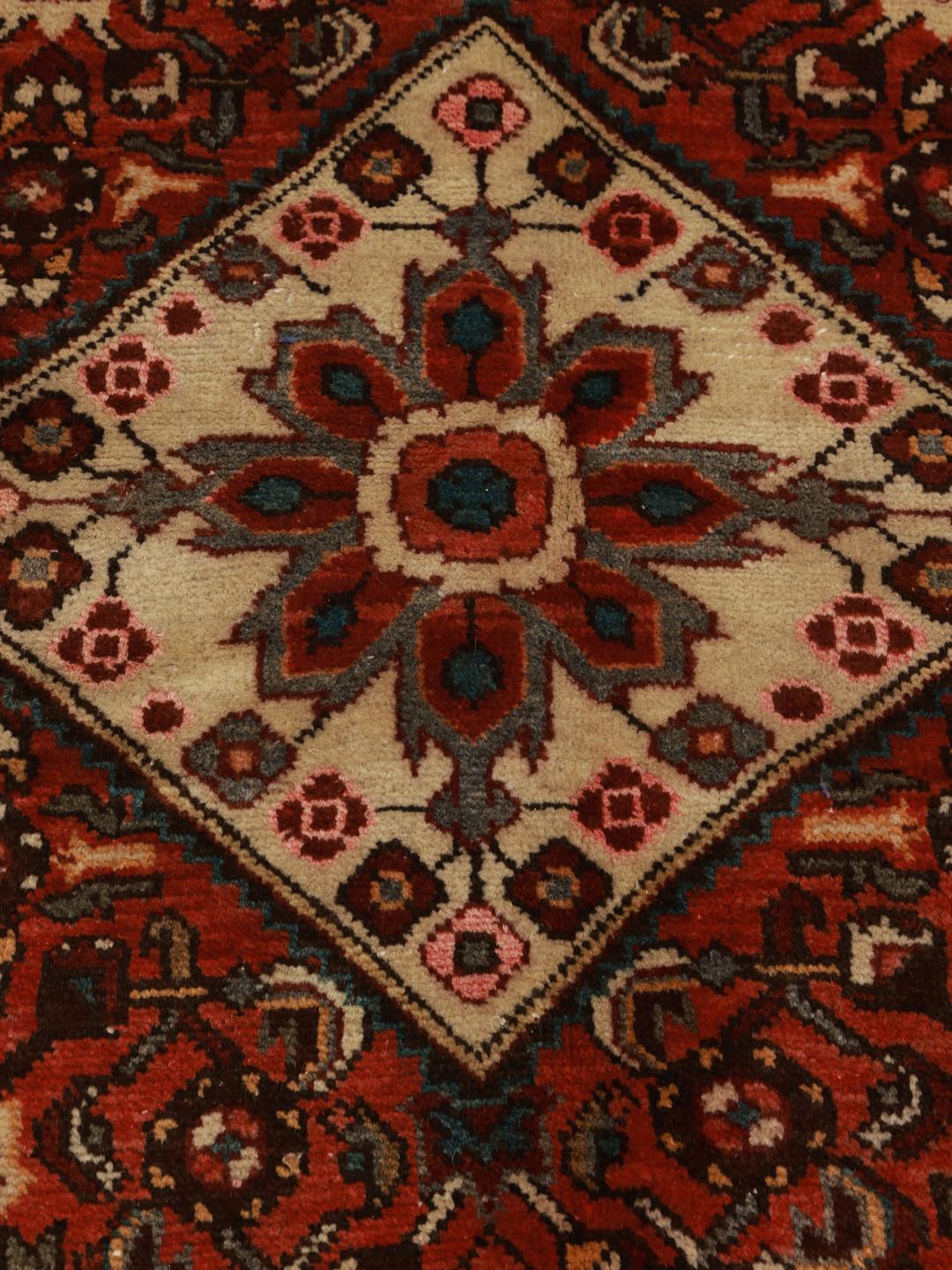 Hand-knotted Hosseinabad rug from the Middle East in shades of red and beige