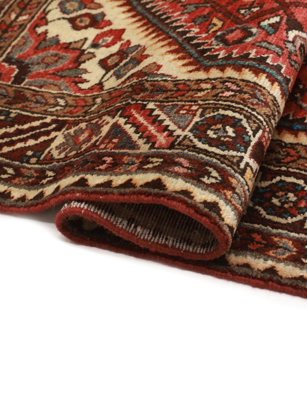 Hand-knotted Hosseinabad rug from the Middle East in shades of red and beige