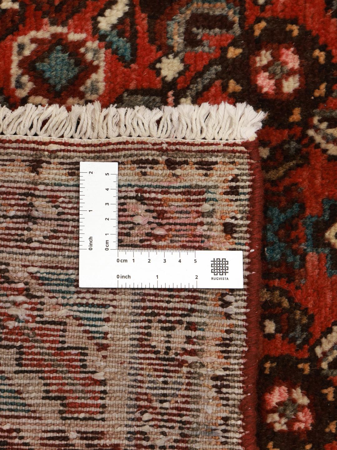 Hand-knotted Hosseinabad rug from the Middle East in shades of red and beige