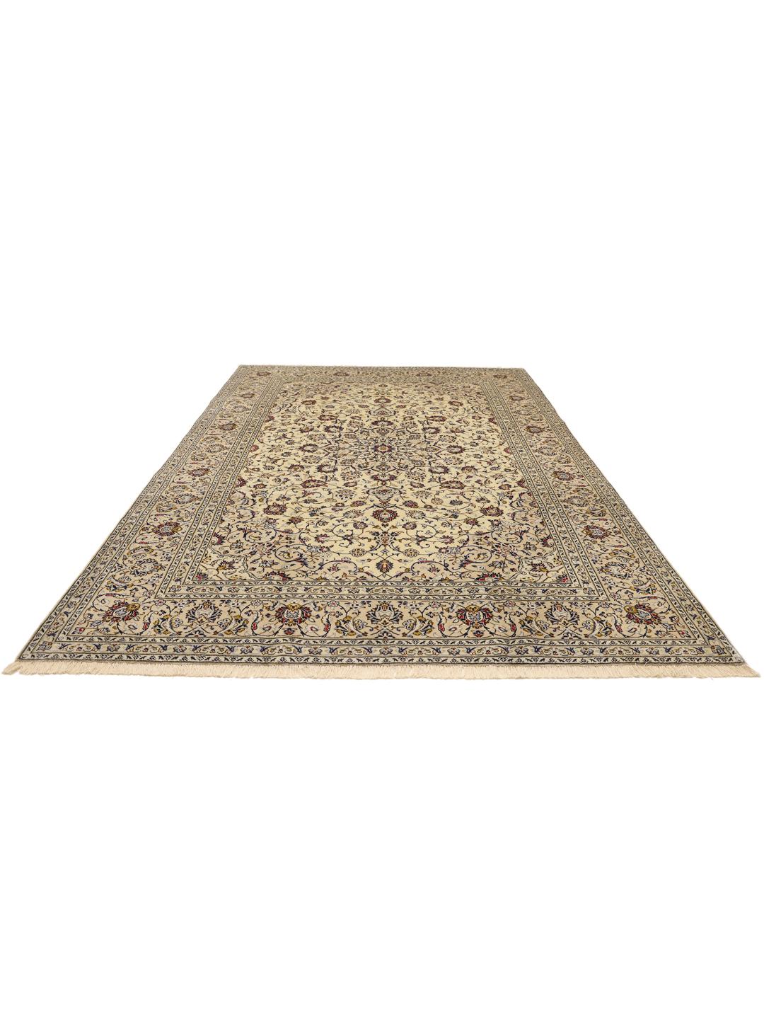A large hand-knotted Keshan rug from the Middle East in beige with floral patterns.