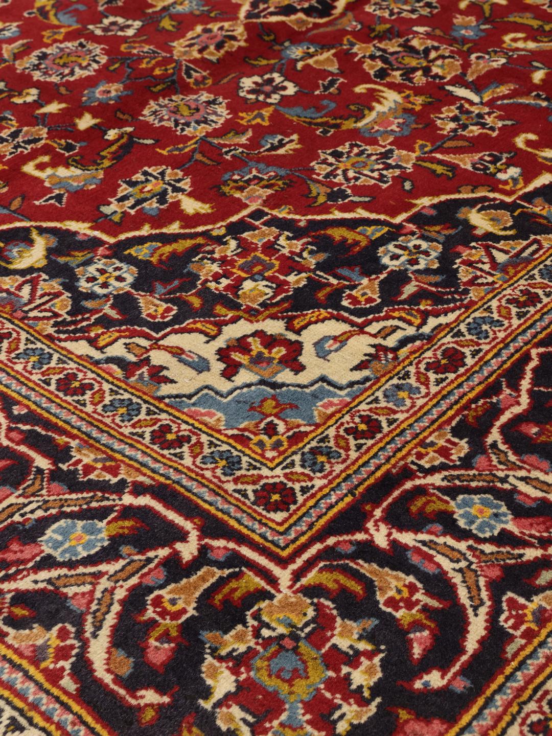 Hand-knotted Keshan rug from the Middle East in red and blue