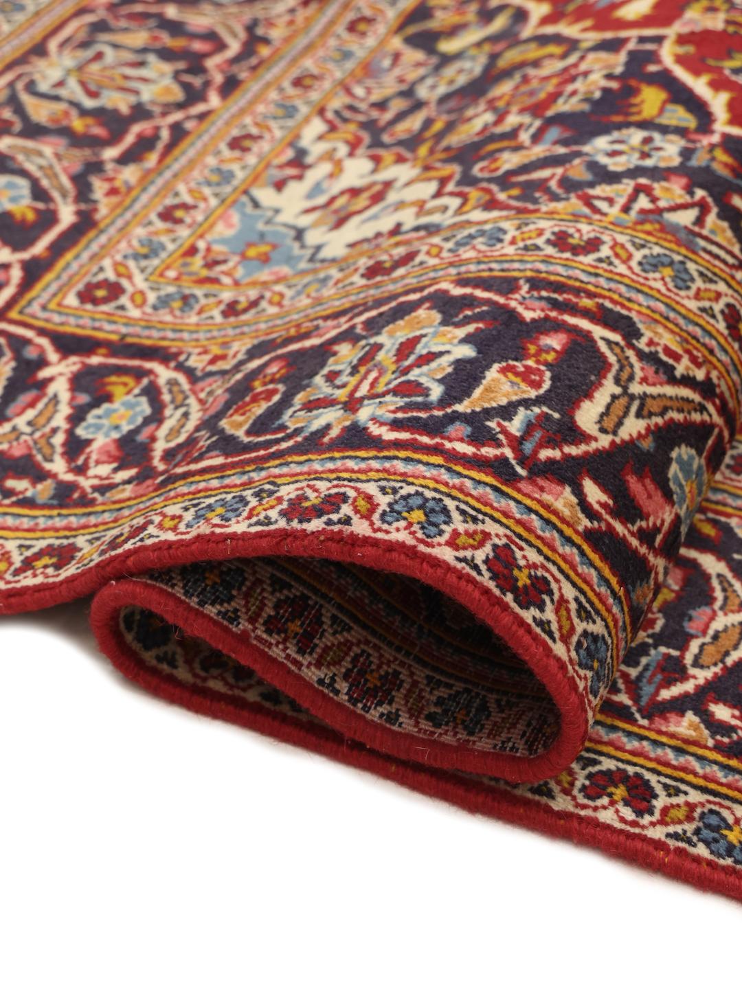 Hand-knotted Keshan rug from the Middle East in red and blue