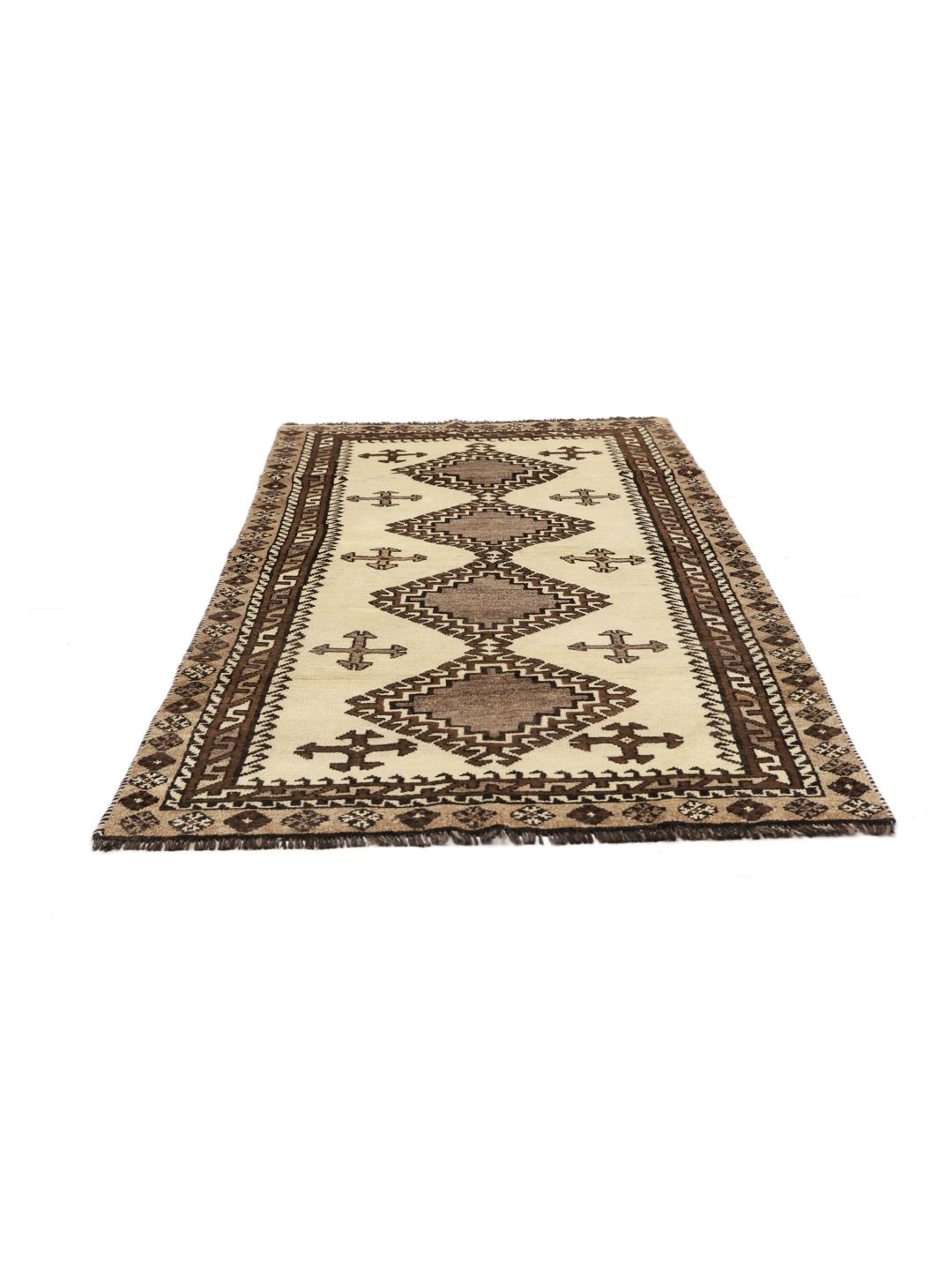 A hand-knotted Shiraz rug from the Middle East featuring geometric patterns in brown and beige.
