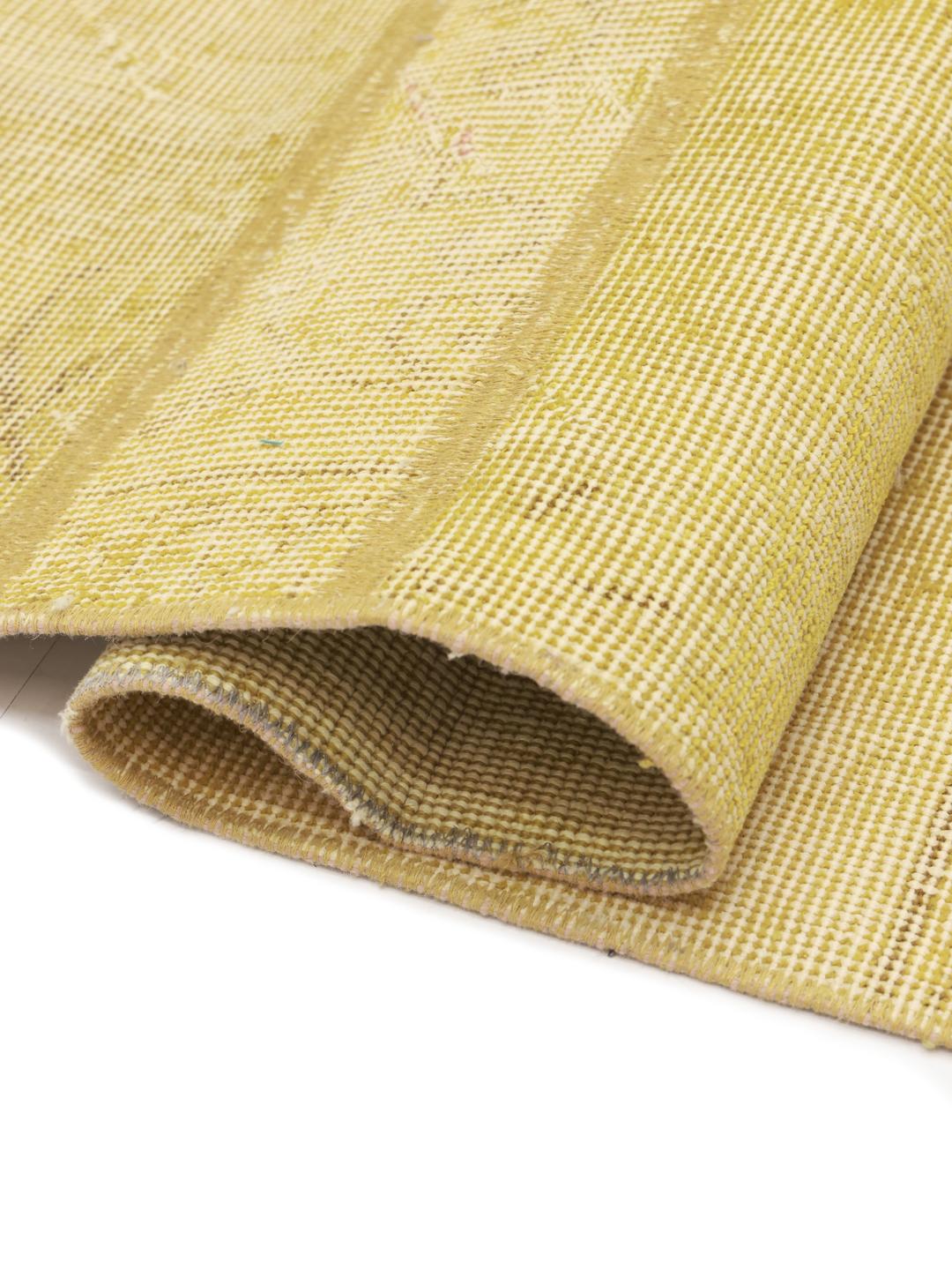 A unique patchwork rug from the Middle East in a soft yellow tone