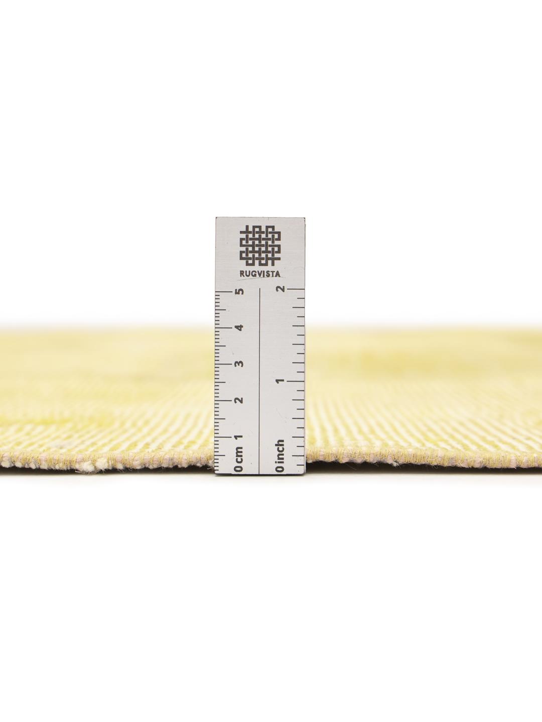 A unique patchwork rug from the Middle East in a soft yellow tone