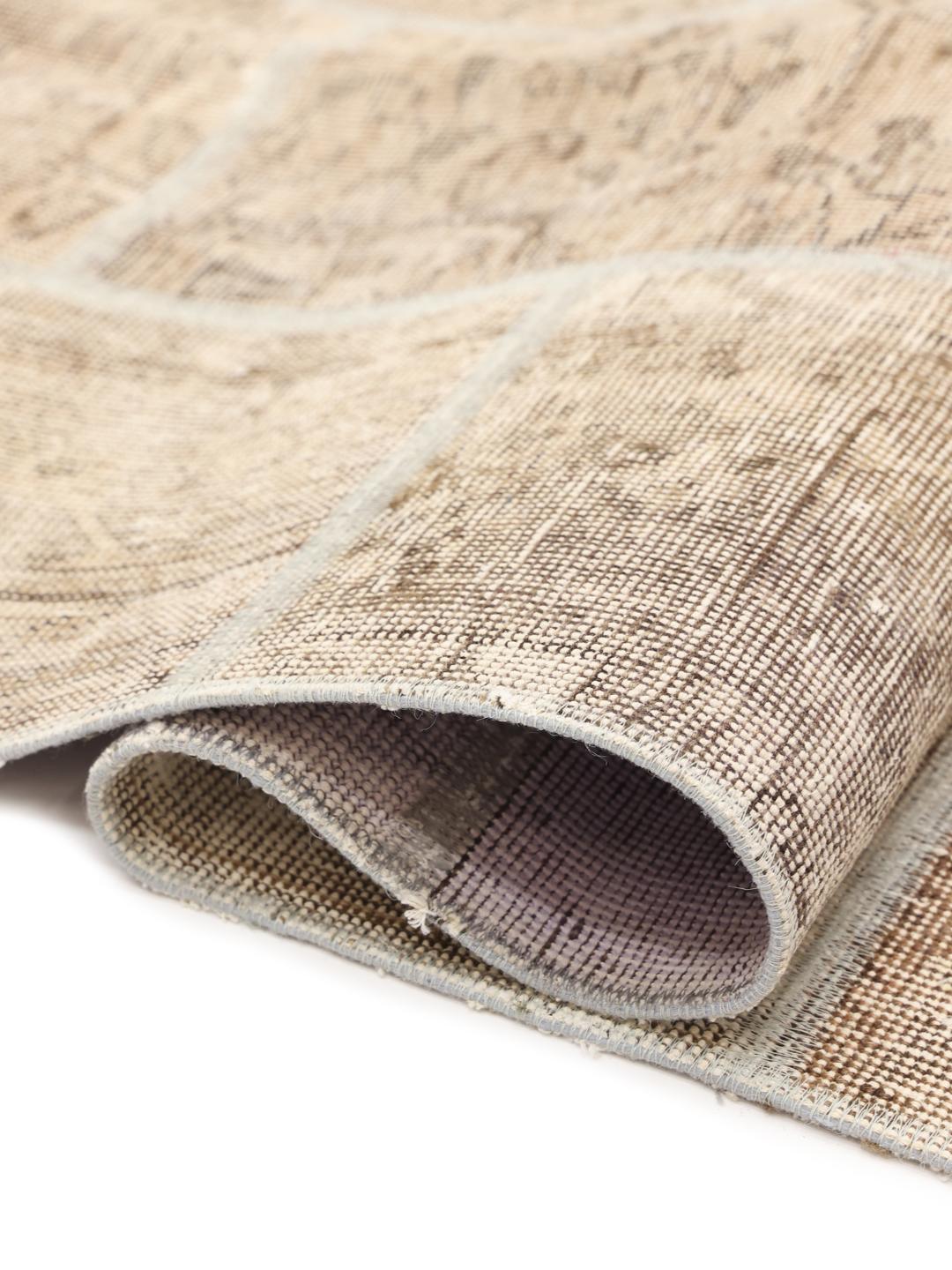 Håndknyttet patchwork-teppe med brune mønstrede segmenter fra Midtøsten