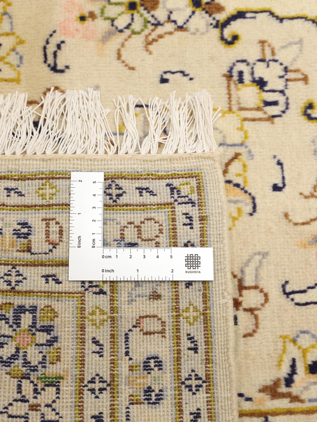 Hand-knotted Keshan rug from the Middle East featuring a beige floral design.