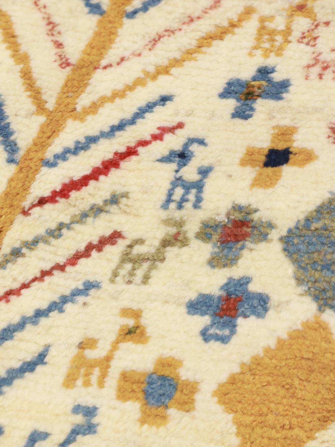 A hand-knotted multicoloured wool Gabbeh rug from the Middle East with whimsical motifs.