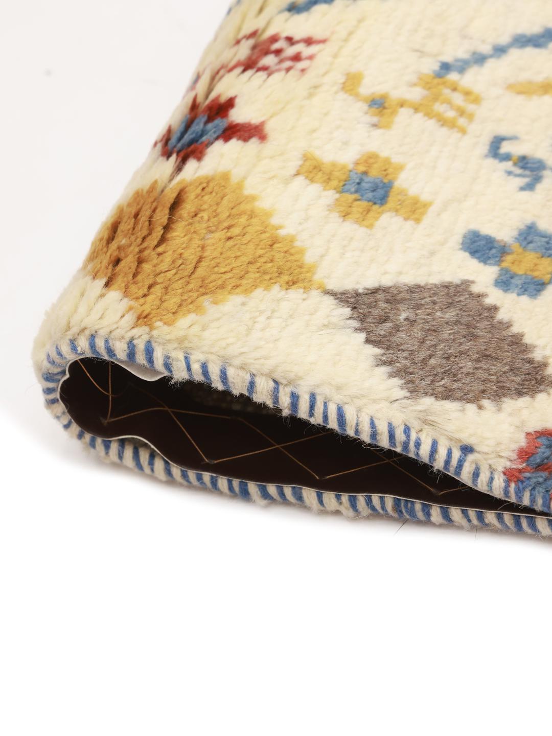 A hand-knotted multicoloured wool Gabbeh rug from the Middle East with whimsical motifs.