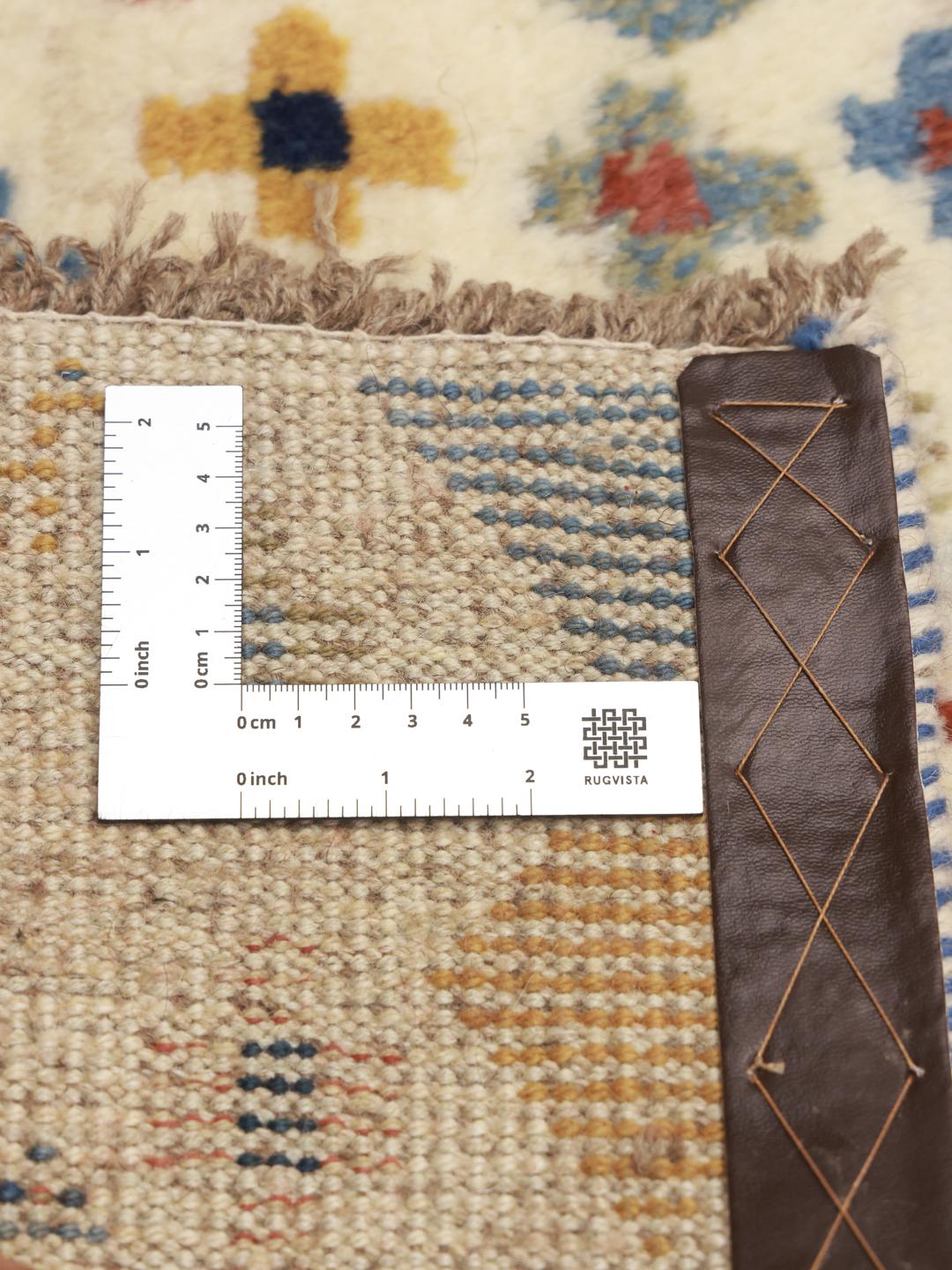 A hand-knotted multicoloured wool Gabbeh rug from the Middle East with whimsical motifs.