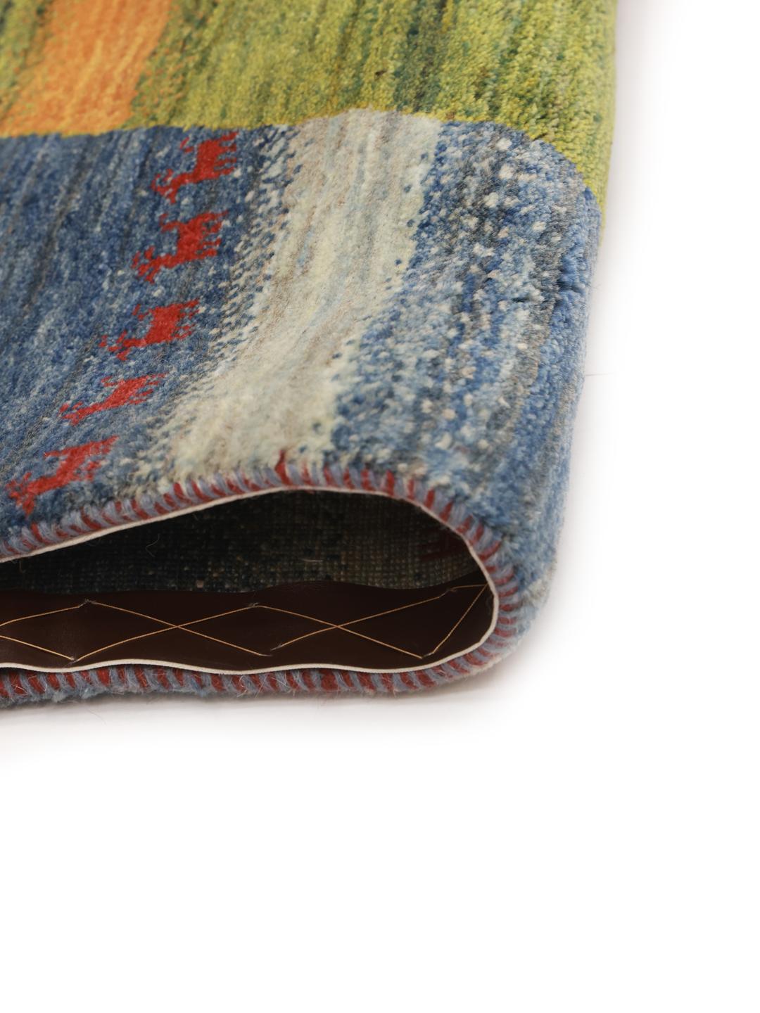 Hand-knotted Gabbeh rug from the Middle East in blue with organic central motif