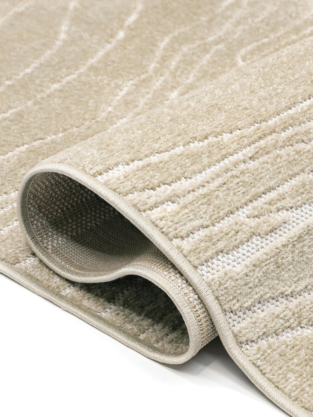 Rond beige tapijt met organische lijnen