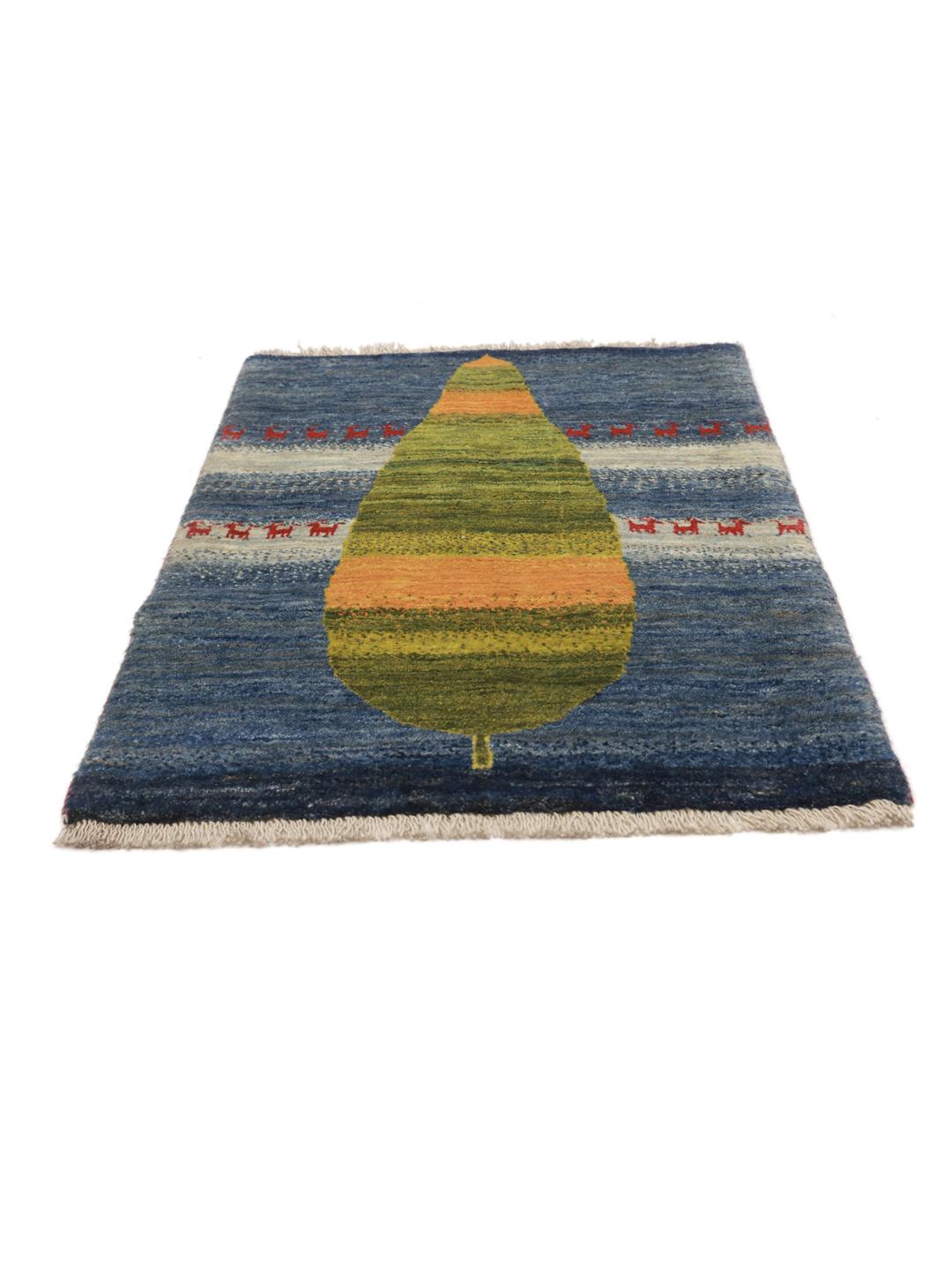 Hand-knotted Gabbeh rug from the Middle East in blue with organic central motif