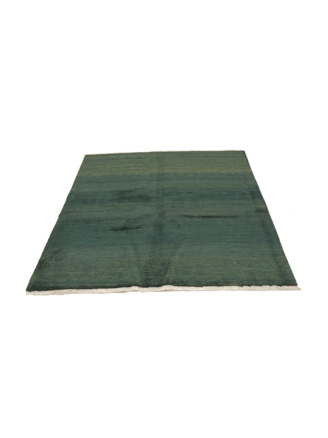 Hand-knotted Gabbeh rug in dark green, originating from the Middle East.