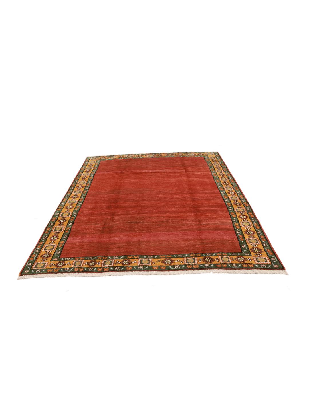 Hand-knotted Gabbeh rug with a red field and decorative border from the Middle East